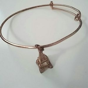 A cute bracelet with a tower on it